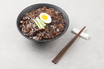 Jjajangmyeon is one of Chinese dishes. The noodles are mixed with Chinese soybean paste stir-fried with meat and vegetables.