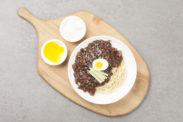 Jjajangmyeon is one of Chinese dishes. The noodles are mixed with Chinese soybean paste stir-fried with meat and vegetables.