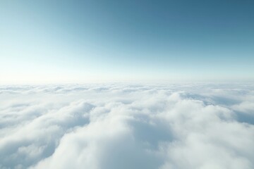 Serene aerial view of a vast expanse of fluffy white clouds beneath a clear blue sky.