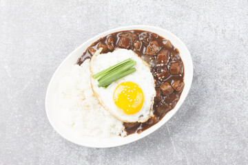 A food made by frying meat, potatoes, pumpkin, and onions in Chinese soybean paste and putting the sauce on top of rice.