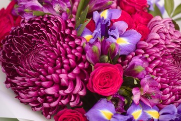 Close-up of bouquet of chrysanthemums, roses, irises, and alstroemerias