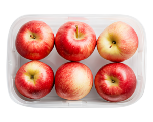 Fresh red apples in plastic container, isolated on transparent background.