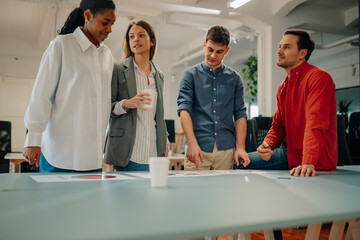 Fototapeta premium Marketing team analyzing charts and reports in modern office