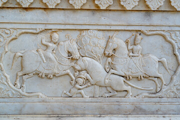 India. Rajasthan. Jaipur. Gatore Ki Chhatriyan. Magnificent marble memorial dedicated to Maharaja Sawai Mansingh II and his family. Bas relief depicting a lion hunt