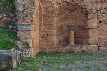 ancient temple ruins of decayed walls and decorative elements like pillar Middle East region land...