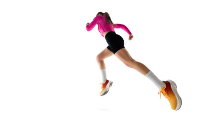 Low angle view of young female runnier in motion, running, showing progress, movement, and athletic...
