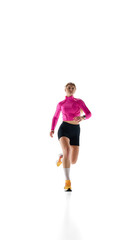 Front view image of young woman in sportswear in motion, training, running against white studio background. Cardio workout. Concept of athletics, sport, endurance, fitness, healthy lifestyle. Ad