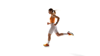 Young sportive woman in orange top and white leggings in motion, running against white studio background. Training. Concept of athletics, sport, endurance, fitness, healthy lifestyle. Ad. Copy space