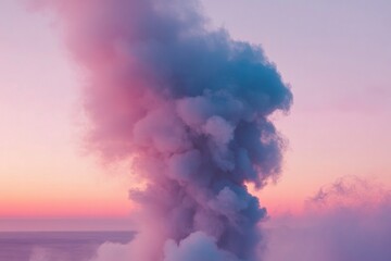 Obraz premium Pastel-colored smoke plume rising against a sunset sky.