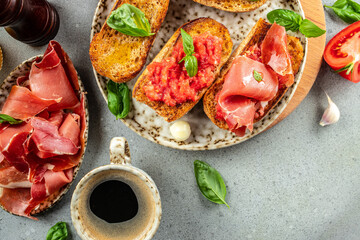 toasted bread with jamon cured ham and tomatoes for breakfast. Restaurant menu, dieting, cookbook recipe top view