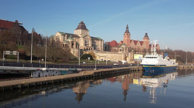 Szczecin Waterfront: Reflected Architecture and Ship on a Sunny Day. Chrobry Embankment, Haken Terrace.