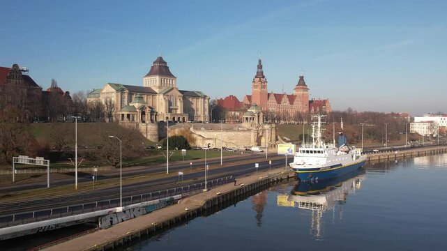 Szczecin Waterfront: Reflected Architecture and Ship on a Sunny Day. Chrobry Embankment, Haken Terrace.