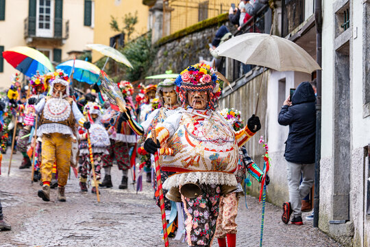 Shignano (Italy) 03/01/23: The carnival of Schignano parade is one of the most famous traditional carnivals of north Italy with typical wood masks and performer that entertain the visitors .