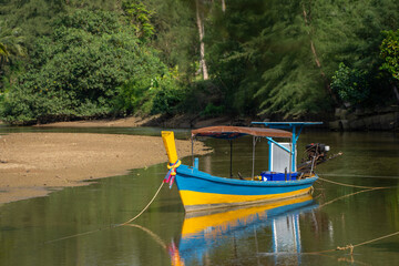 A longtail boat at a river in the south of Thailand