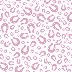 Pink silhouette of lucky horseshoe. Seamless vector pattern. Endless ornament. Isolated colorless background. Horse shoes in glamorous pink color. St. Patricks Day. Flat style. Repeating symbol.