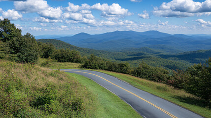 Naklejka premium A winding road meanders through lush green hills under a blue sky dotted with fluffy clouds, showcasing a serene landscape.