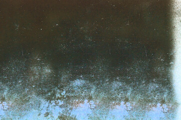 Background image in blue tones with spots and streaks on the surface