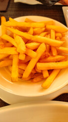 Serving of french fries sitting on restaurant table in croatia