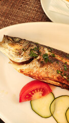 Grilled sea bass with vegetables enjoyed during summer vacation in croatia