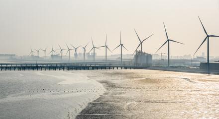 Wind turbine farm by the sea, generating green energy