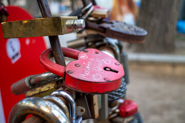 A Love Padlock In The Shape Of A Heart Among Many Others Of The Same Kind