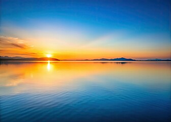 Obraz premium Serene sunset landscape; calm waters, clean lines, geometric shapes define this minimalist nature scene.