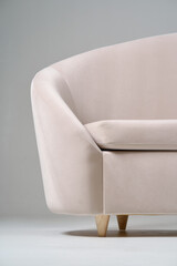 Modern Beige Armchair with Minimalist Wooden Frame Design..