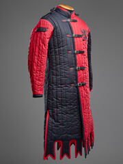 Historical fashion. Medieval knight cloth. Padded jacket gambeson.