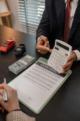 a car salesman is explaining the details of a car and the pricer that a buyer is interested in, the showroom sales manager explained the amount of interest
