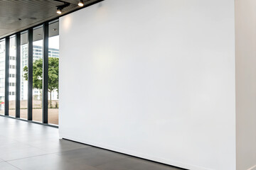 Front view Free Business Logo white blank mockup template on the white wall background.