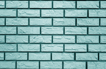 Decorative cyan toned brick wall texture and pattern.