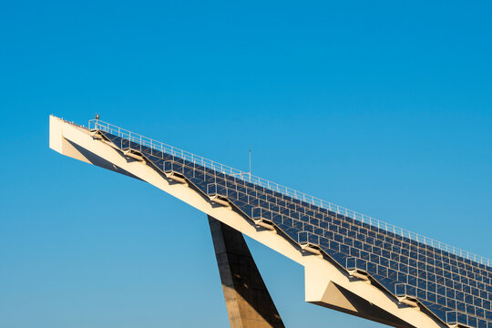 Geometric view of solar panel structure with strong architectural lines, emphasizing sustainable energy solutions.