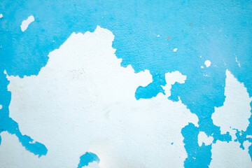 Weathered blue wall with peeling paint, grunge texture ideal for creative design and photography backdrops