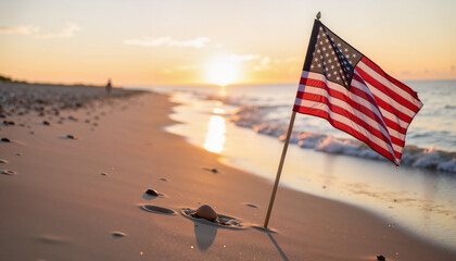 American flag waving at sunset on beach, celebrating Independence Day