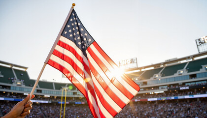 Cheering crowd waving American flag at sports stadium, game day spirit