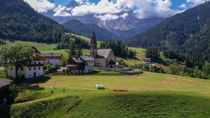 The Odle  Group mountain peaks and the church of Santa Maddalena in the Valley of Funes, South Tyrol in northern Italy. The church is dedicated to St. Magdalene.