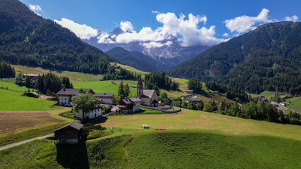 The Odle  Group mountain peaks and the church of Santa Maddalena in the Valley of Funes, South Tyrol in northern Italy. The church is dedicated to St. Magdalene.
