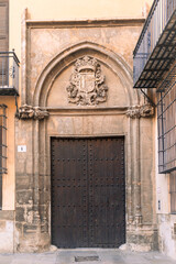 Fototapeta premium Old vintage wooden door in the city center of Valencia, Spain