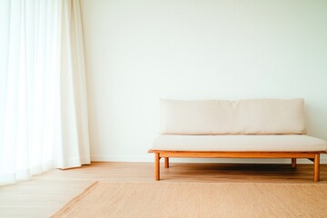 Minimalist interior features soft sofa with natural light illumi
