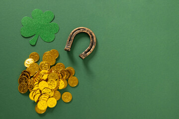 St. Patrick's day frame with clover leaf, golden coins and horseshoe on green background. View from...