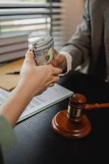lawyer and client shake hands after receiving bribes for illegal deals, a client is bribing the opposing lawyer in order to win a case, corruption and bribery are illegal