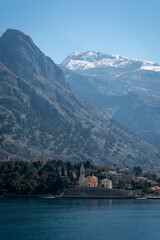 View of the small town of Dobrota with a backdrop of  mountains in Kotor bay, Montenegro