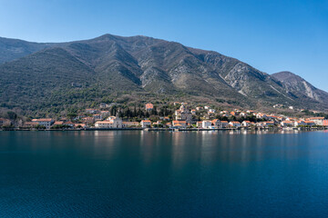 View of a small town with a backdrop of mountains in Kotor bay, Montenegro