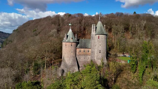 Stunning drone footage of Castell Coch near Cardiff, showcasing its fairytale architecture, lush woodland setting, and historic charm through cinematic aerial and scenic shots.