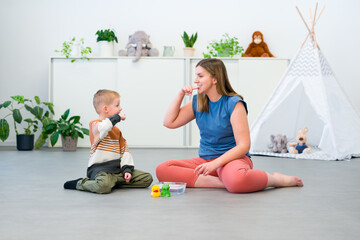 Baby Sign Language. Nonverbal child learning to sign with the help of a speech therapist. Child...