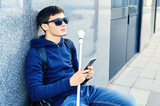 Blind person uses a special smartphone app adapted for the blind, technological accessibility for people with disabilities