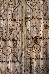 Close up. Background. Old wooden dilapidated door. Islamic pattern