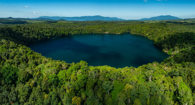 landscape of rainforest and deep blue lake