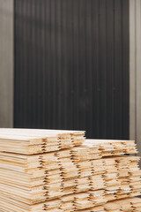 Stack of wooden planks ready for modular building construction