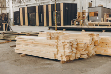 Wooden planks stacked in modular building construction factory